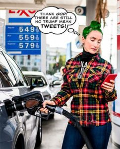 woman pumping gas while looking at phone