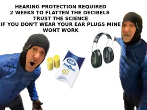 angry blue jacket man pointing at ear plugs ottawa trucker