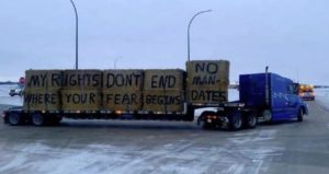 canada trucker protest sign on side of truck
