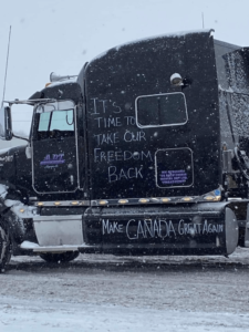 writing on side of truck in canada protest convoy