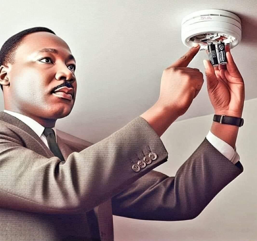 martin luther king putting battery in smoke detector alarm